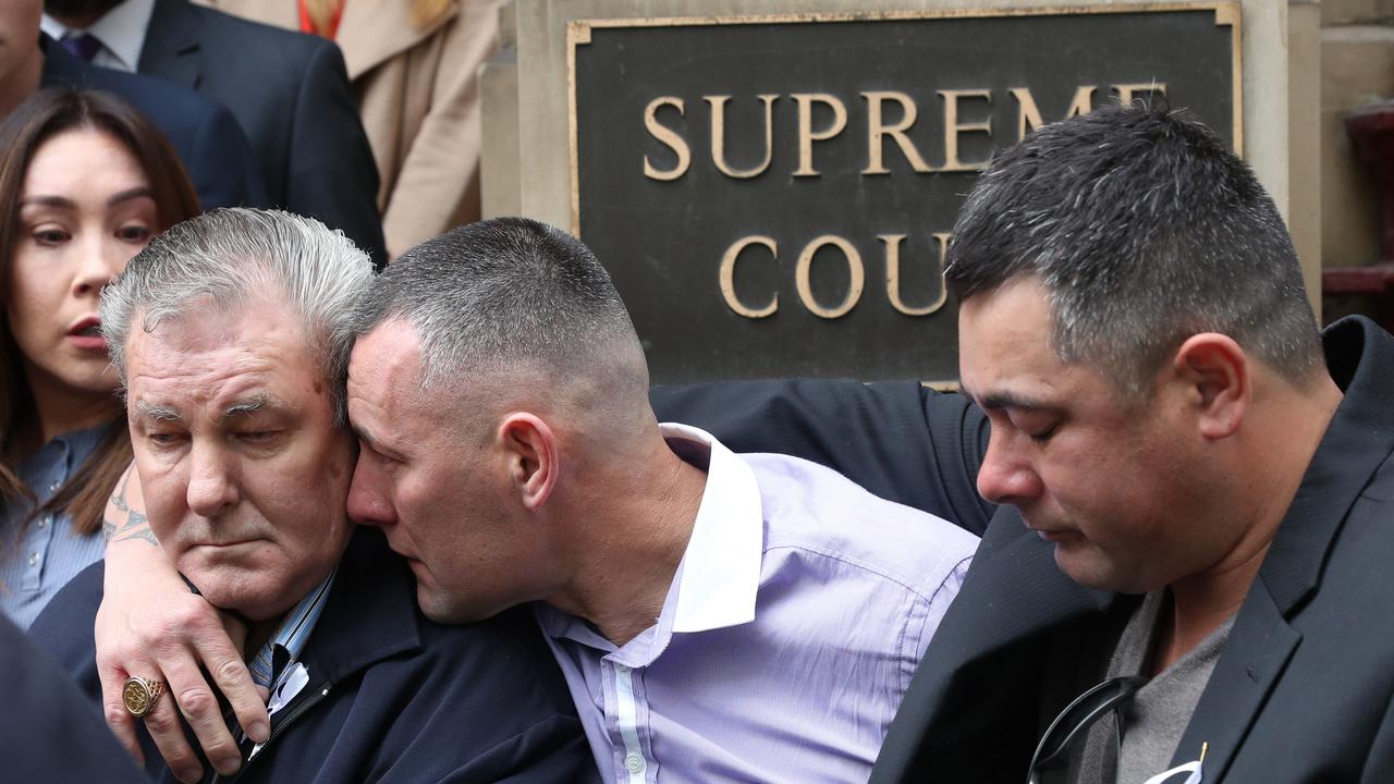 Alicia’s father is comforted outside the court. Picture: David Crosling.