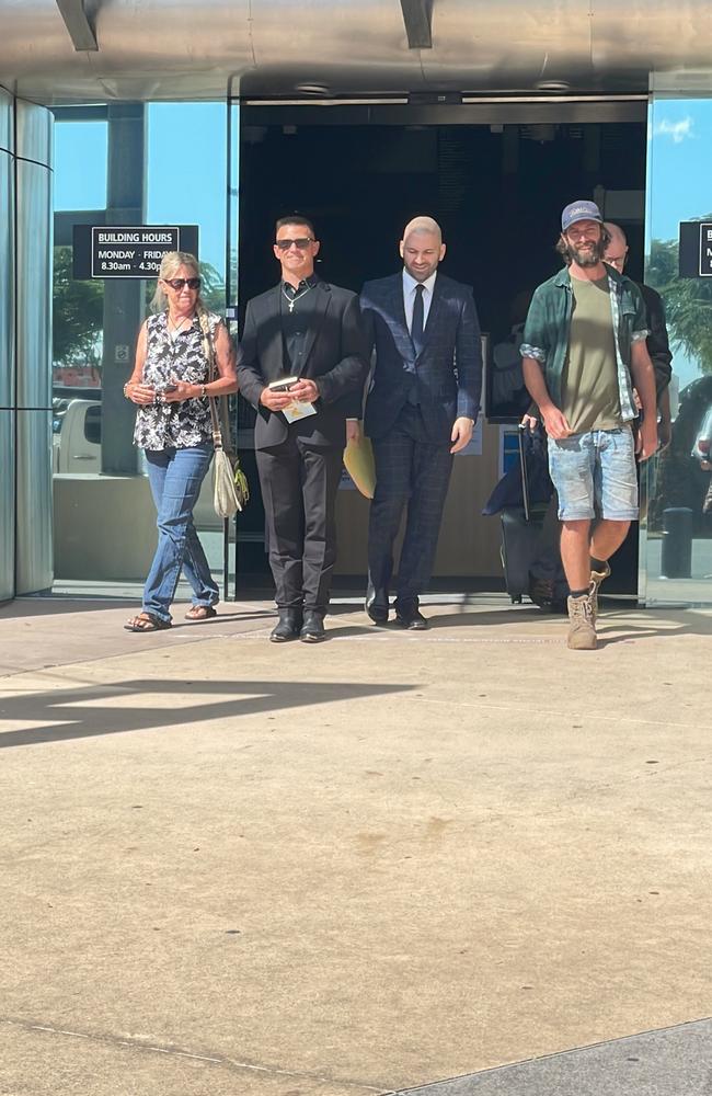 Henchman owner Jared Fairall (black shirt) outside court with is lawyer Farshad Sarabi, of Hannay Lawyers.