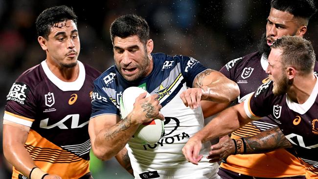 James Tamou runs into trouble as three Broncos surround him. Picture: Bradley Kanaris/Getty Images