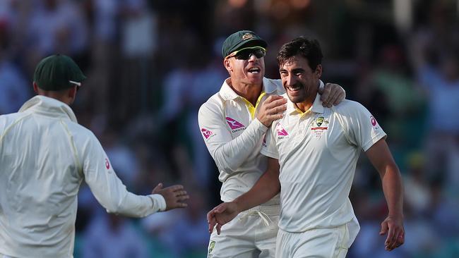 Australia's Mitchell Starc celebrates the wicket of England's Joe Root out caught by Australia's Mitchell Marsh during Day 1 of the 5th Ashes Test between Australia and England at the SCG. Picture: Brett Costello