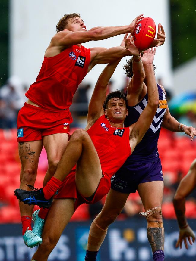 Jed Walter climbs over a pack.