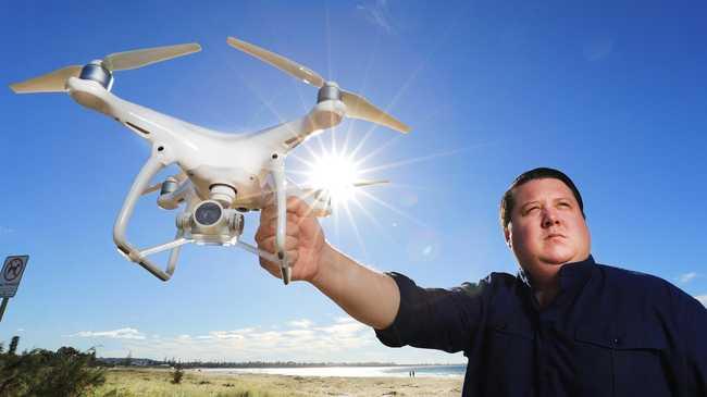 Tweed Shire Councillor Reece Byrnes with a drone camera unit at Kingscliff. Photo: Scott Powick, Newscorp