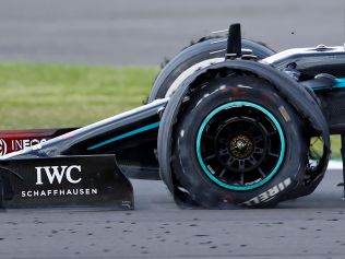 The punctured tyre of Mercedes' British driver Lewis Hamilton punctures is pictured as he goes on to win the Formula One British Grand Prix. (Photo by ANDREW BOYERS / POOL / AFP)