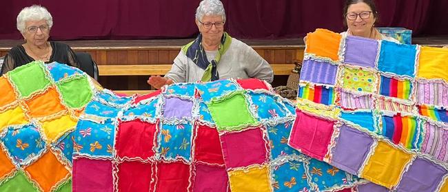 Valley Spinners' Connie Muscat, Margaret Borg and Judy Sologinkin crafting quilts to be donated to Ronald McDonald House in Townsville. Picture: Contributed