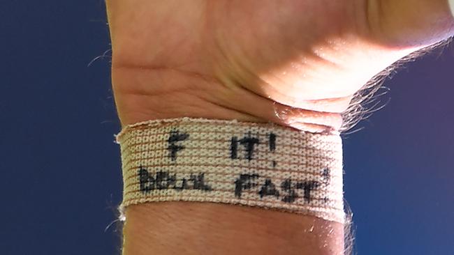 A wristband on the bowling arm of Mitchell Starc. Picture: AAP