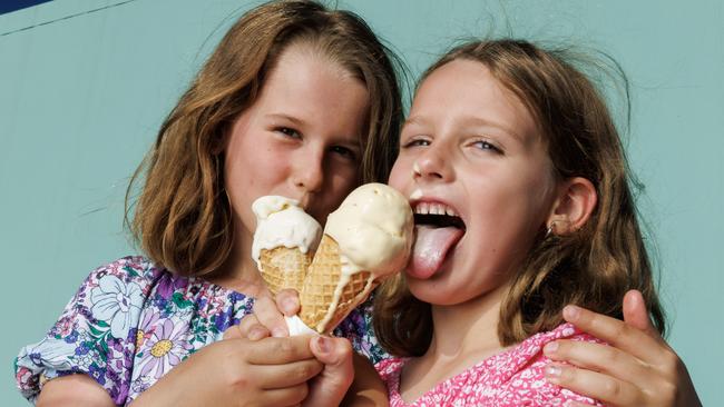 Sisters Josie 9, and Pippa Carlisle 7, from Tarragindi, try out some award winning gelato from Milani Minus Eight Degrees Gelateria at Market Square in Sunnybank.  Picture Lachie Millard