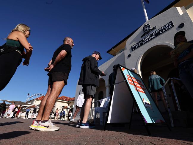 Voters queue up at a polling station on Bondi Beach in Sydney. Picture: AFP