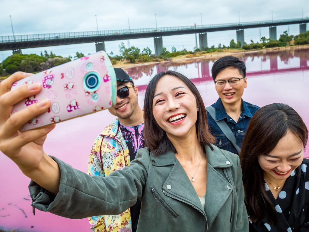 Pink Lake - Westgate Park. The pink lake at Westgate Park has become one of the most selfied and Instagrammed places in Victoria. (L-R) Alex, Sheehan, Abner and Chloe take a selfie. Picture: Jake Nowakowski