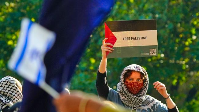 Pro-Palestinian and pro-Israel protesters face off at Melbourne University. on Thursday, May 2, 2024. Picture: Luis Enrique Ascui