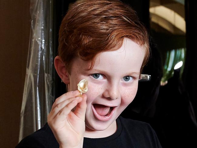 SYDNEY, AUSTRALIA - Harrison, 6, from the Keen family, a winner of the Coles Golden Avocado Stikeez promotion poses in front of their new Smeg fridge on March 02, 2020 in Sydney, Australia. (Photo by Jaimi Joy/Getty Images for Coles)