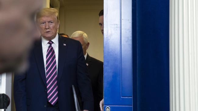 President Donald Trump arrives to speak about the coronavirus in the James Brady Press Briefing Room of the White House overnight.