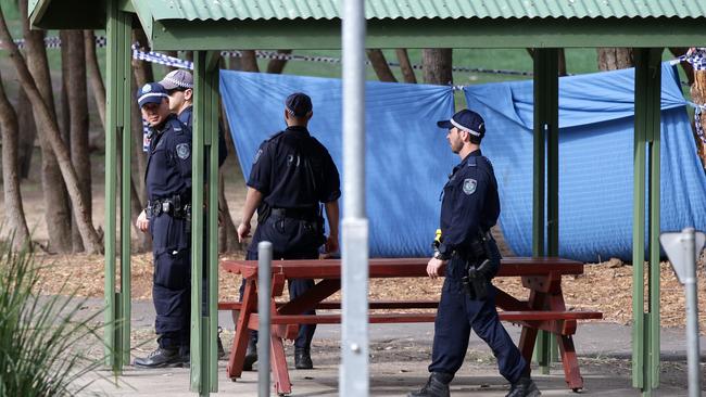 Police officers at Buffalo Creek Reserve Playground in Hunters Hill after the body of a woman was discovered. Picture: Jonathan Ng