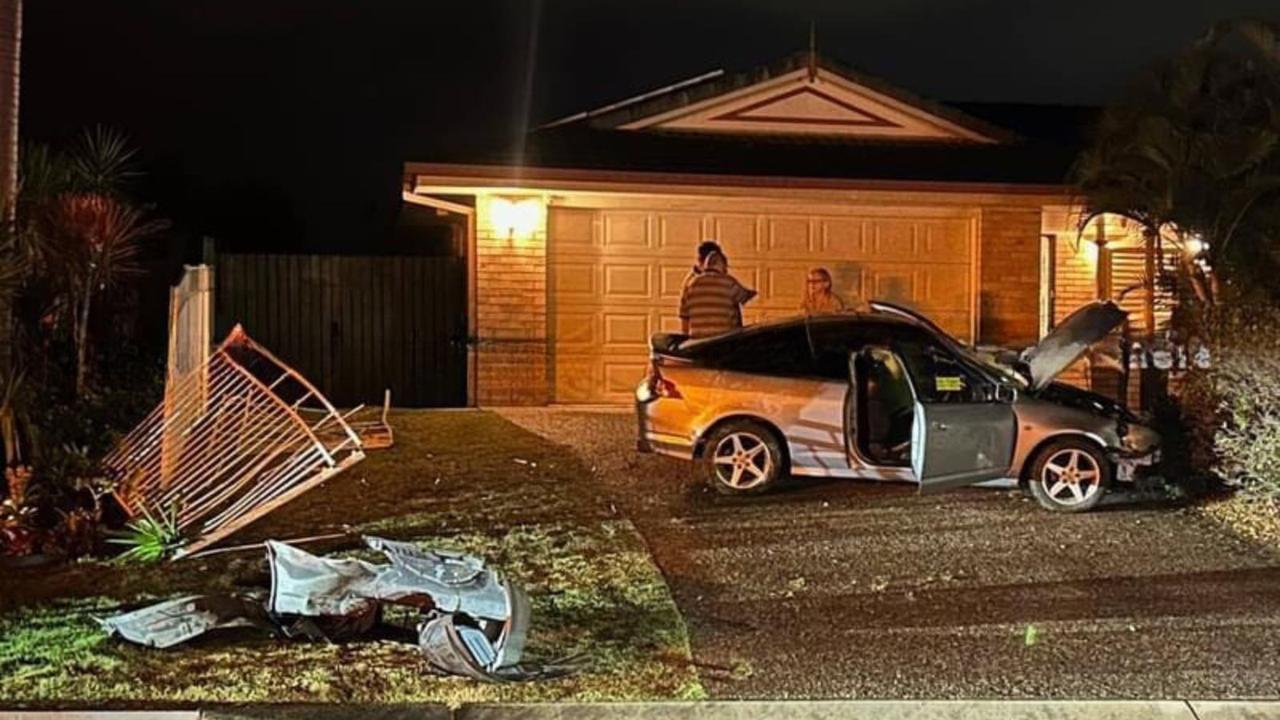 Man charged with drink driving after car smashes through fence