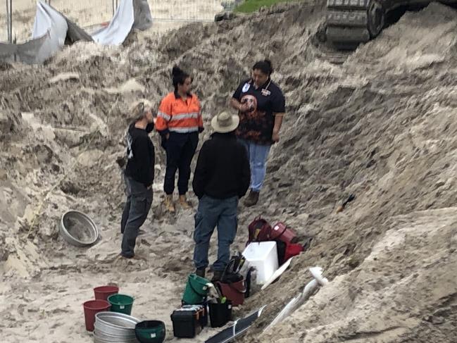 Officials from the Aboriginal Heritage Office and Metropolitan Local Aboriginal Land Council at the construction site at Little Manly Beach a day after Northern Beaches Council contractors, building a new seawall, uncovered human bones on July 25. Picture: Jim O'Rourke