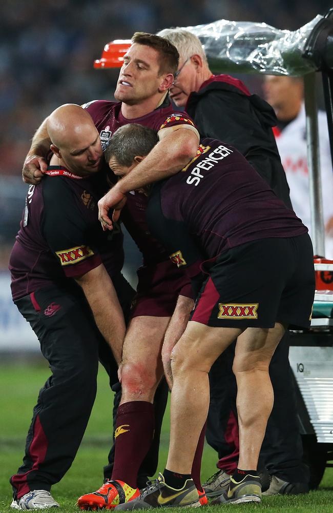 QLD's Brent Tate goes down injured.