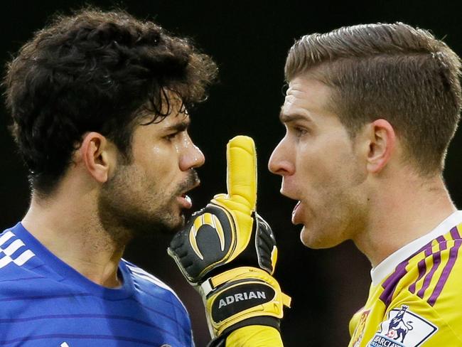 Chelsea's Diego Costa, left, argues with West Ham United's goalkeeper Adrian during the English Premier League soccer match between Chelsea and West Ham at Stamford Bridge stadium in London, Friday, Dec. 26, 2014. (AP Photo/Matt Dunham)