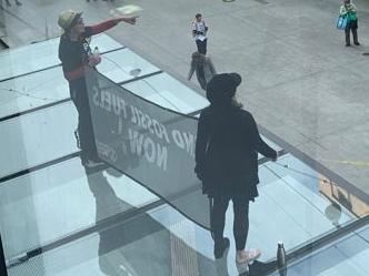 extinction rebellion in Rundle Mall, huge sign saying end fossil fuels now. Picture Kitty Barr