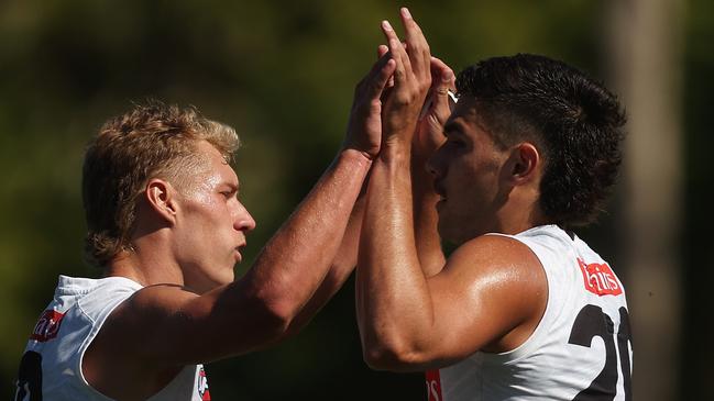 MELBOURNE, AUSTRALIA - FEBRUARY 21: Finlay Macrae of the Magpies and Reef McInnes of the Magpies celebrate during an AFL practice match between North Melbourne Kangaroos and Collingwood Magpies at AIA Centre on February 21, 2024 in Melbourne, Australia. (Photo by Daniel Pockett/Getty Images)