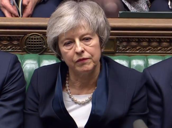 A video grab from footage broadcast by the UK Parliament's Parliamentary Recording Unit (PRU) shows Britain's Prime Minister Theresa May reacting as Labour Party leader Jeremy Corbyn informs the MPs that he has tabled a vote of no confidence in the Government in the House of Commons in London on January 15, 2019, after MPs voted to reject the government's Brexit deal. - British lawmakers voted overwhelmingly Tuesday to reject the EU divorce deal struck between London and Brussels, in a historic vote that leave Brexit hanging in the balance. (Photo by HO / PRU / AFP) / RESTRICTED TO EDITORIAL USE - MANDATORY CREDIT 