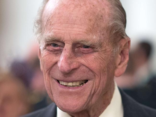 Britain's Prince Philip, Duke of Edinburgh meets guests during a reception for Canadian regiments and decendents who fought in WWI battles at Canada House in central London on April 19, 2015. The event marked the centenary of World War 1 battles involving three Canadian regiments. AFP PHOTO / POOL / LEON NEAL