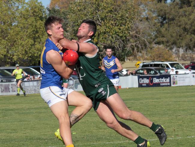 Jason Hura cops a forearm. Picture: Glenn Milne