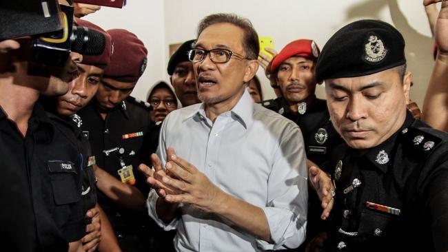 The then-jailed Anwar Ibrahim walks out from a court in Kuala Lumpur in September 2016. Picture: AFP