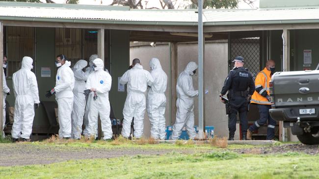 Police suit up for the search in Wollert. Picture: Tony Gough