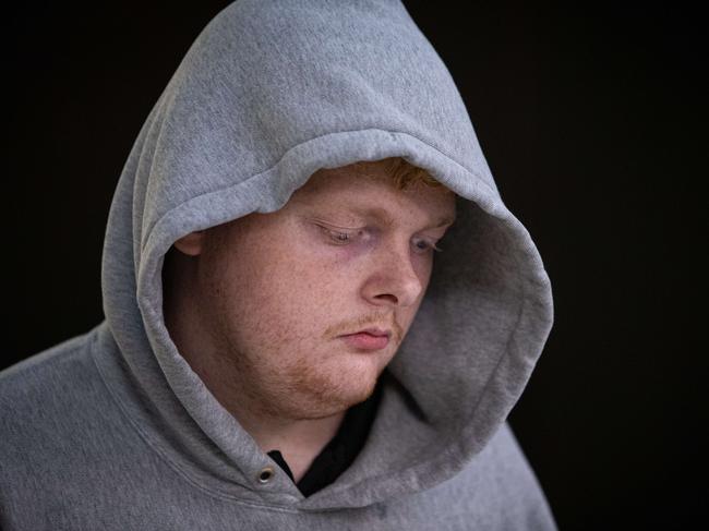 Daniel Barton through Sydney Airport after he was arrested in Western Australia for several outstanding sexual assault warrants. Pic by Julian Andrews