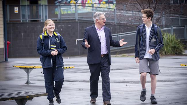 St Aloysius Catholic College year 8 students Erica Brcic (left), and Ethan Jones (right) with principal Joseph Sandric, Picture: LUKE BOWDEN