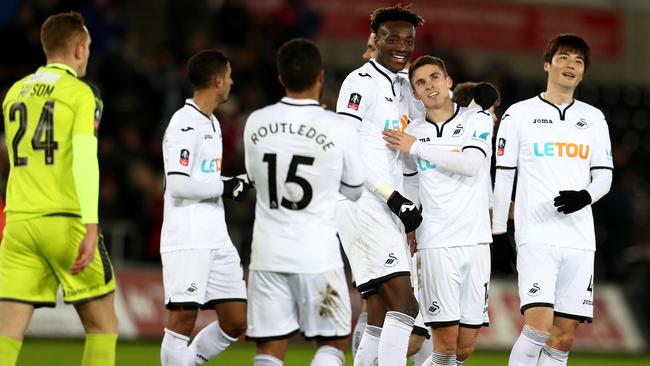 Tom Carroll of Swansea City celebrates.