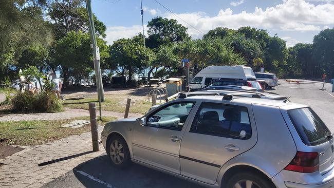 Beachgoers head back into the surf as carparks around Byron Bay reopen.