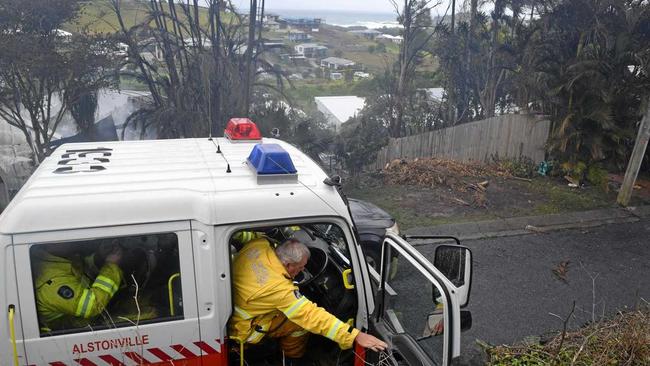 Crews at Survey St where two houses were destroyed by a fire on Sunday morning. Picture: Jasmine Burke