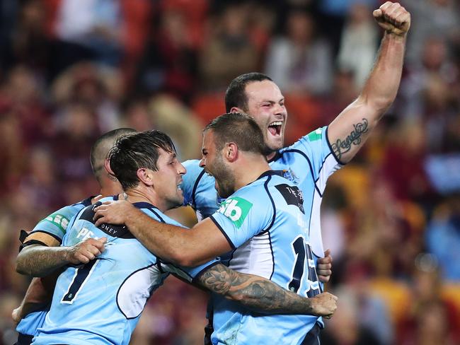 NSW celebrate a try by Mitchell Pearce. Picture: Brett Costello