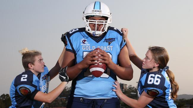 Stingrays Juniors have made it to the QLD Superbowl. The U/16 girls trtying to work out how to tackle man mountain Matthew Ioane 16. from left, Lorrilee Clifford 15,Matthew Ioane 15, Neve Tomkins 14, training at Nerang. Picture Glenn Hamposon