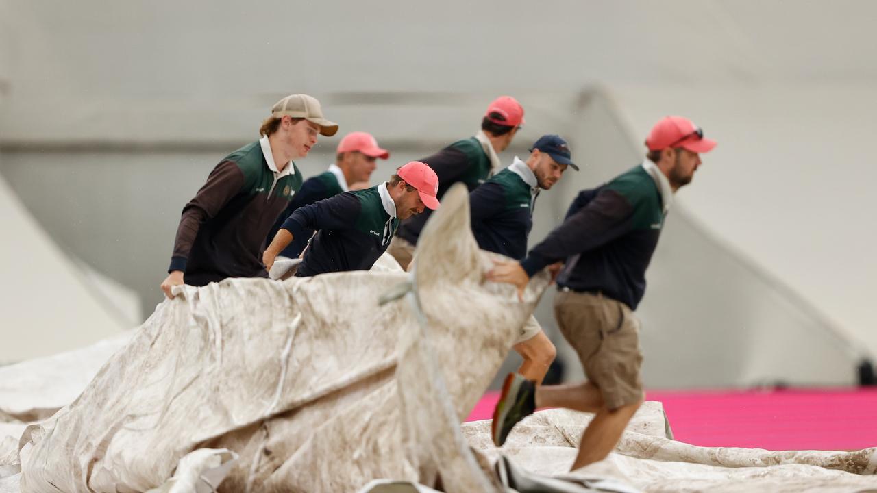 A familiar sight... rain hits the SCG and the ground staff are the busiest people at the ground. Picture: Getty