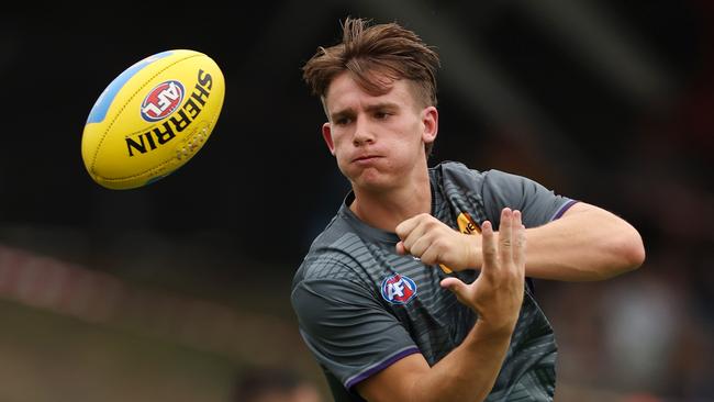 PERTH, AUSTRALIA - FEBRUARY 24: Caleb Serong of the Dockers warms up before an AFL practice match between West Coast Eagles and Fremantle Dockers at Mineral Resources Park on February 24, 2024 in Perth, Australia. (Photo by Will Russell/Getty Images)