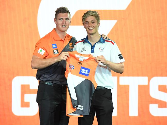 Jackson Hately with new GWS team-mate Adam Tomlinson after being selected by the Giants at pick No. 14 in the 2018 AFL Draft.