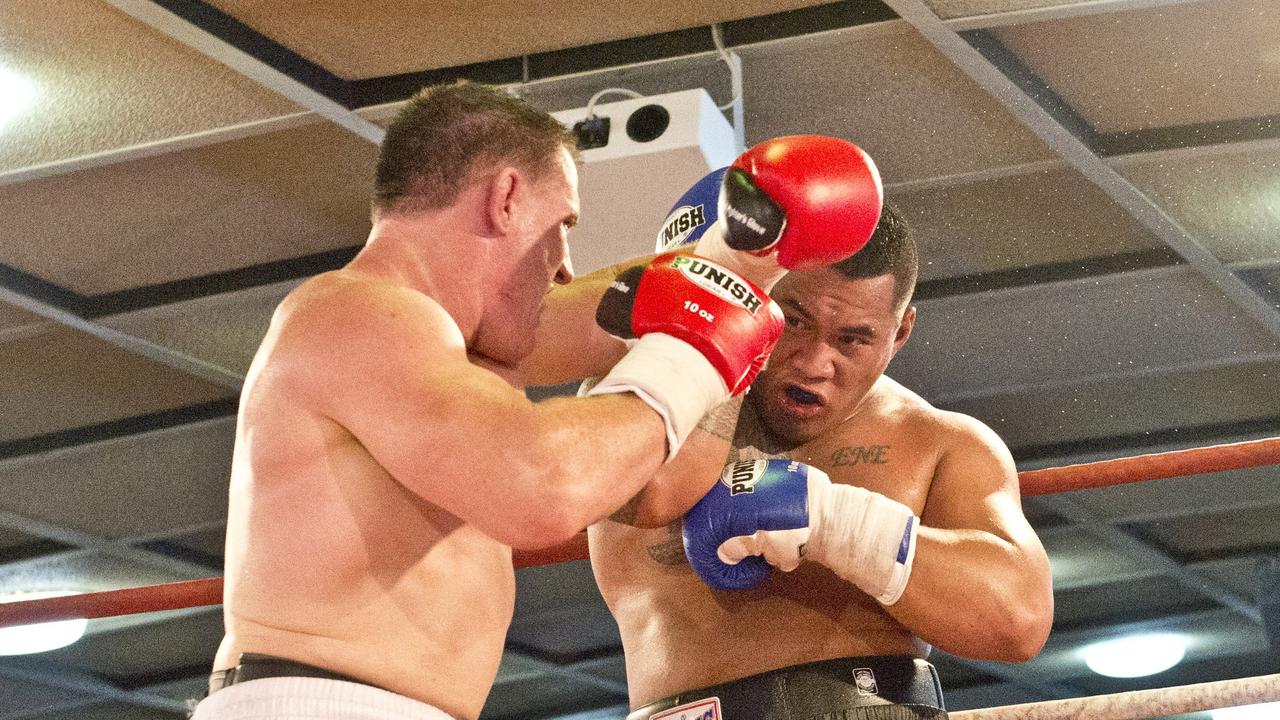 Paul Gallen (left) and Hermann Ene-Purcell fight it out in Toowoomba. Friday, Jan 29, 2016.