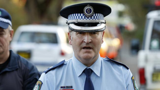 NSW Police Detective Acting Superintendent John Nelson speaking as an operation is underway near the Conservation Hut at Wentworth Falls. Picture: Jonathan Ng