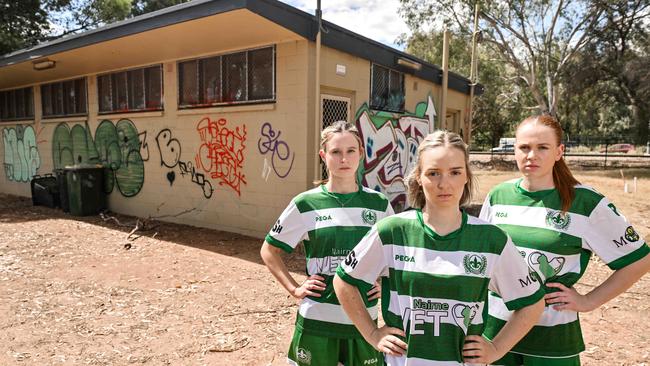 Mercedes Old Collegiate soccer players Hannah George, Madeleine Price and Ellie Teitzel at their derelict clubrooms in Park 21. Picture: Brenton Edwards