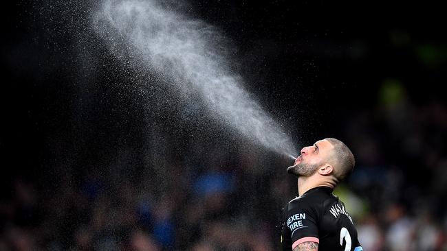 Manchester City’s Kyle Walker spits out water during the loss to Tottenham Hotspur