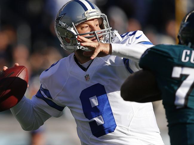 PHILADELPHIA, PA - JANUARY 01: Quarterback Tony Romo #9 of the Dallas Cowboys attempts his first pass of the season as Vinny Curry #75 of the Philadelphia Eagles closes in during the second quarter of a game at Lincoln Financial Field on January 1, 2017 in Philadelphia, Pennsylvania. Rich Schultz/Getty Images/AFP == FOR NEWSPAPERS, INTERNET, TELCOS & TELEVISION USE ONLY ==