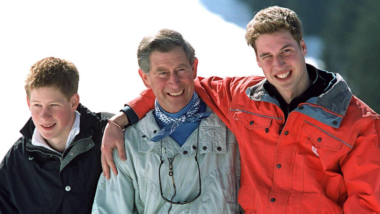 Prince Harry and Prince William stand next to Prince Charles in 2002. Picture: UK Press/Getty Images