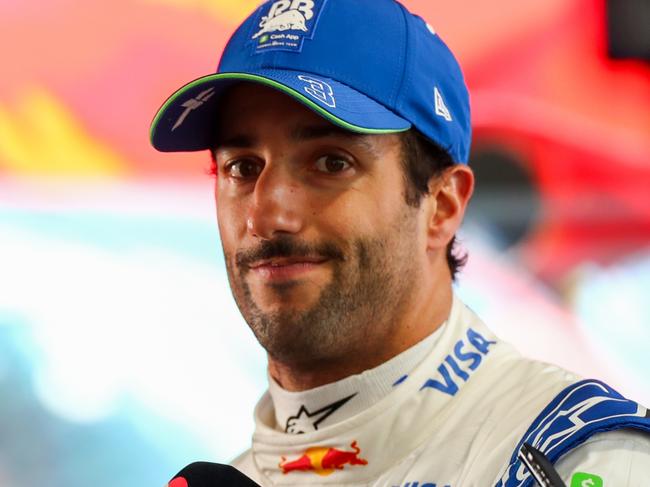 MELBOURNE, AUSTRALIA - MARCH 23: Daniel Ricciardo of Australia and Visa Cash App RB talks to the media during qualifying ahead of the F1 Grand Prix of Australia at Albert Park Circuit on March 23, 2024 in Melbourne, Australia. (Photo by Peter Fox/Getty Images)