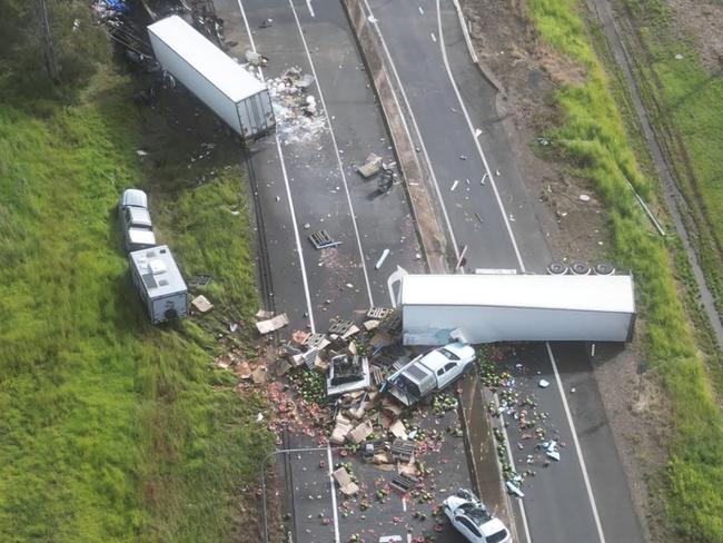 An aerial photo shows the devastating scene in which at least three people have died in a five vehicle crash on the Bruce Highway near Maryborough. MUST CREDIT  pics by Michael O'connor