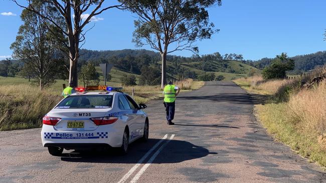 Police closed off the road at the scene. Picture: Peter Lorimer 