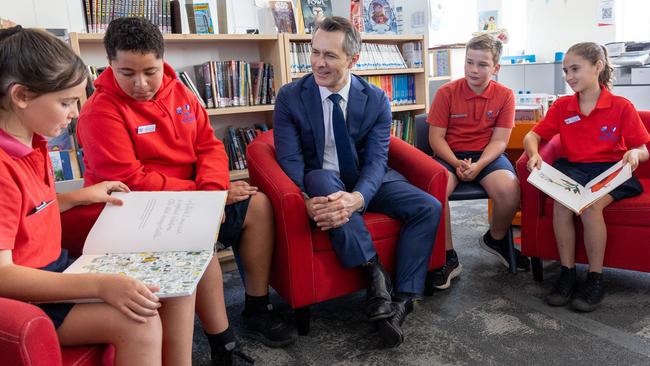 Federal Education Minister Jason Clare with students from Telopea Park School. The Minister says it’s “worrying” that kids are enjoying reading less. Picture: NCA NewsWire / Gary Ramage