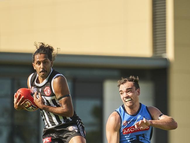 Anthony Wilson takes a grab for Port Adelaide. Picture: Matt Loxton