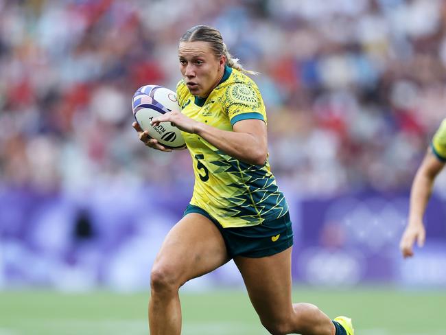 Teagan Levi of Team Australia runs with the ball during the Women's Rugby Sevens Bronze medal match.Picture: Cameron Spencer/Getty Images.