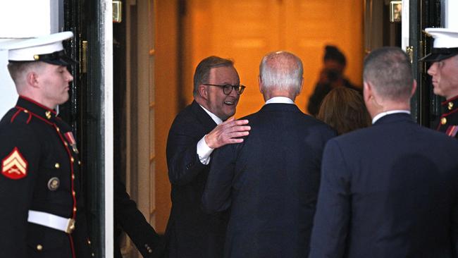 Australia's Prime Minister Anthony Albanese (L) greets US President Joe Biden (C) at the South Portico of the White House in Washington DC.